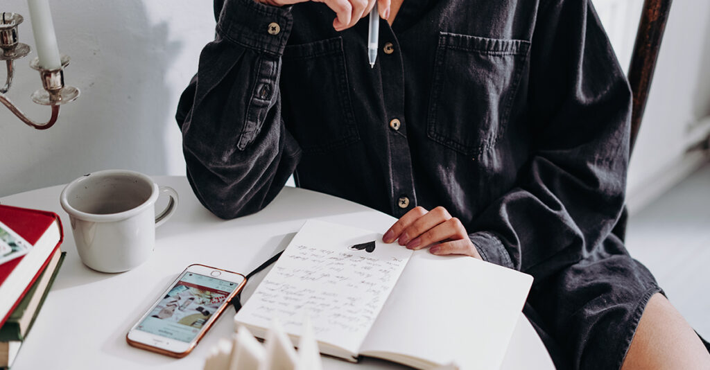 Woman writing in her journal