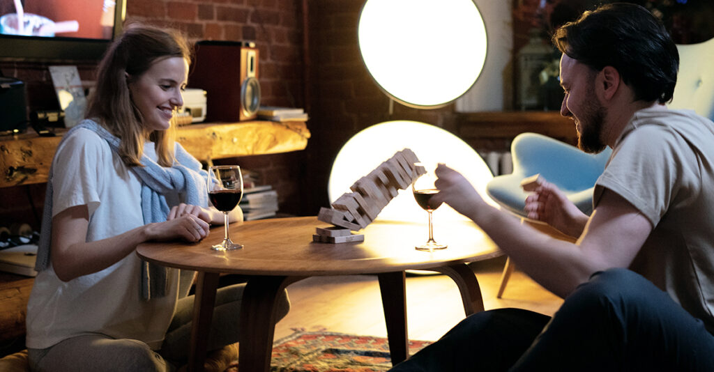 Man and woman playing Jenga